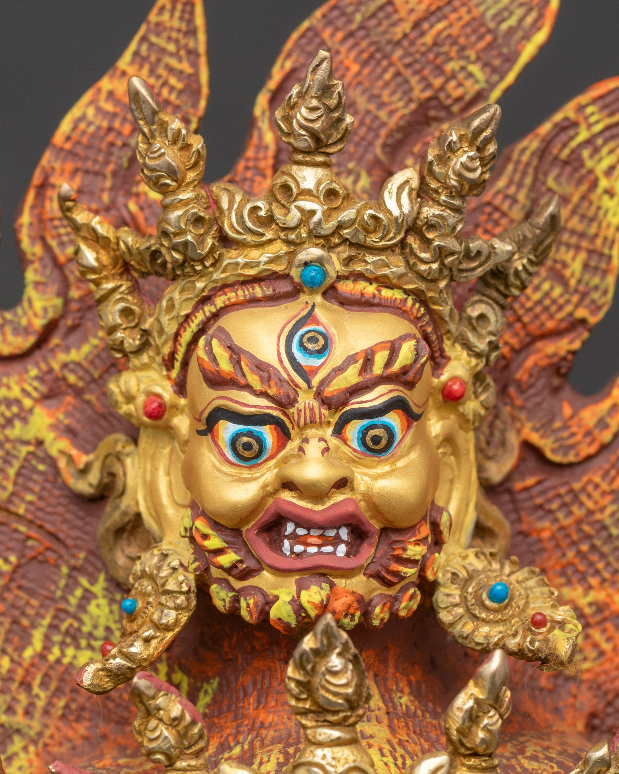 Detailed close-up of Mahakala face with blazing eyes and wrathful expressions