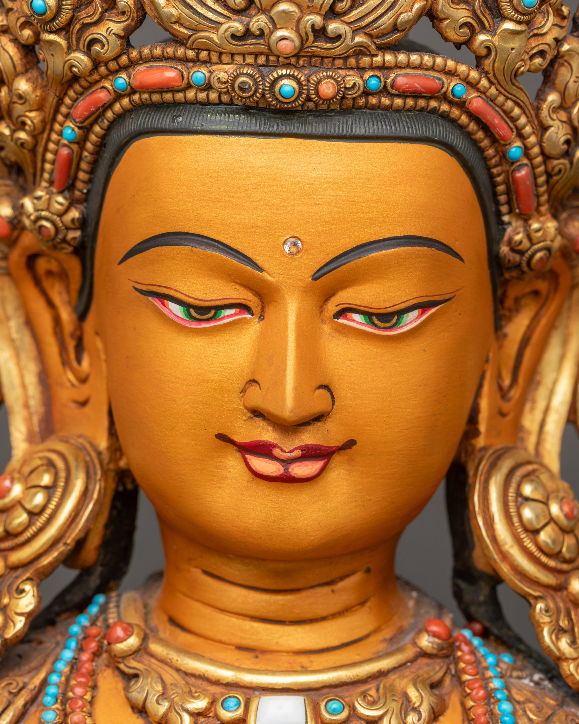 Detailed close-up of Manjushri face with tranquil gaze and thangka-style hand painting