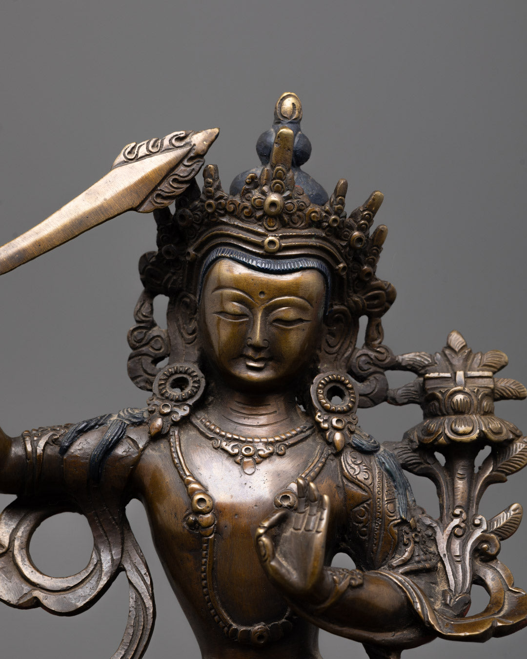Detailed close-up of Manjushri’s sword symbolizing wisdom