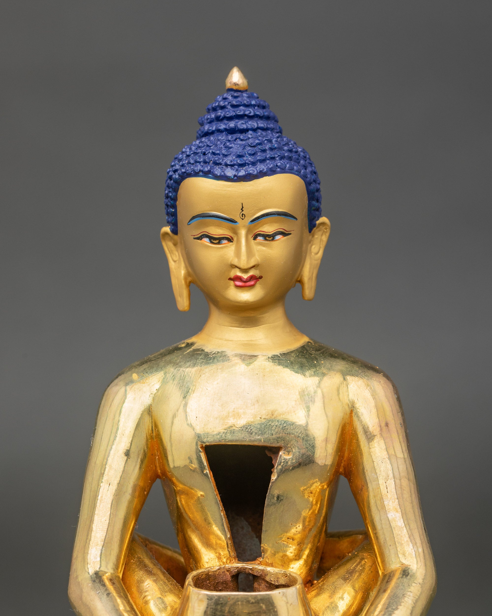 Detailed close-up of Samantabhadra face, gold fire-gilded copper Tibetan statue