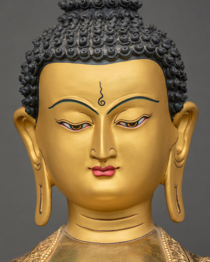 Detailed close-up of Shakyamuni Buddha Figurine face – 24K gold fire-gilded sculpture