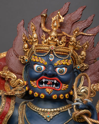Detailed close-up of Vajrapani’s fierce face with piercing eyes, bared fangs, and flaming hair