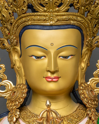 Detailed close-up of Vajrasattva face with 24K gold-painted features and serene expression
