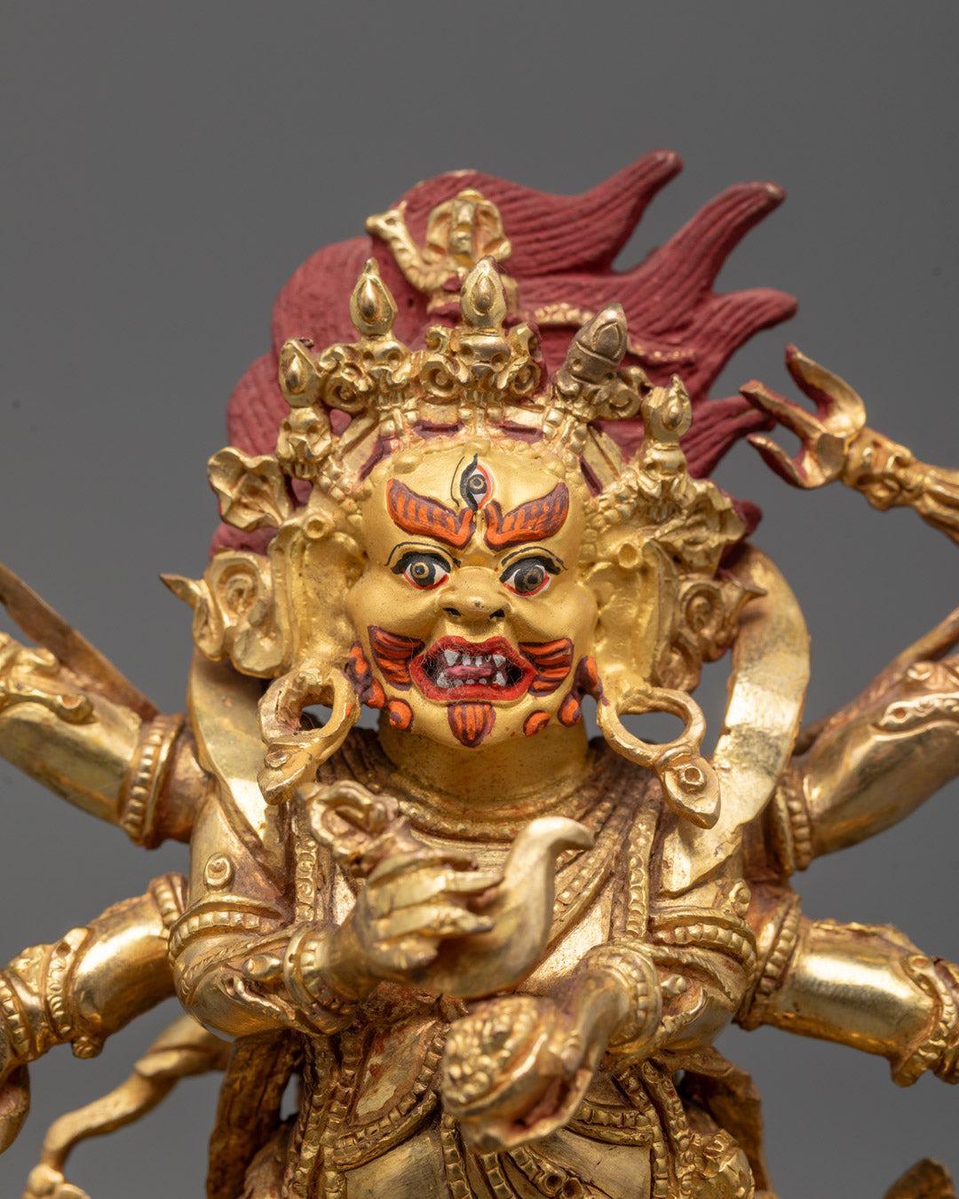 Detailed close-up of a hand-carved Six Armed Mahakala Statue showcasing