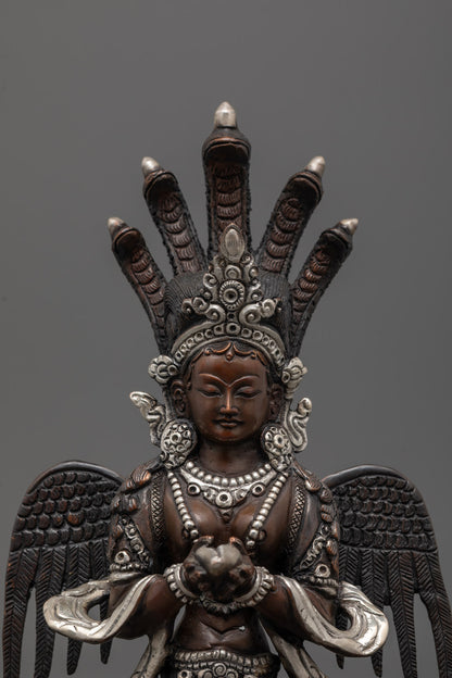 Detailed close-up of a traditional Naga Kanya statue showing the half-woman