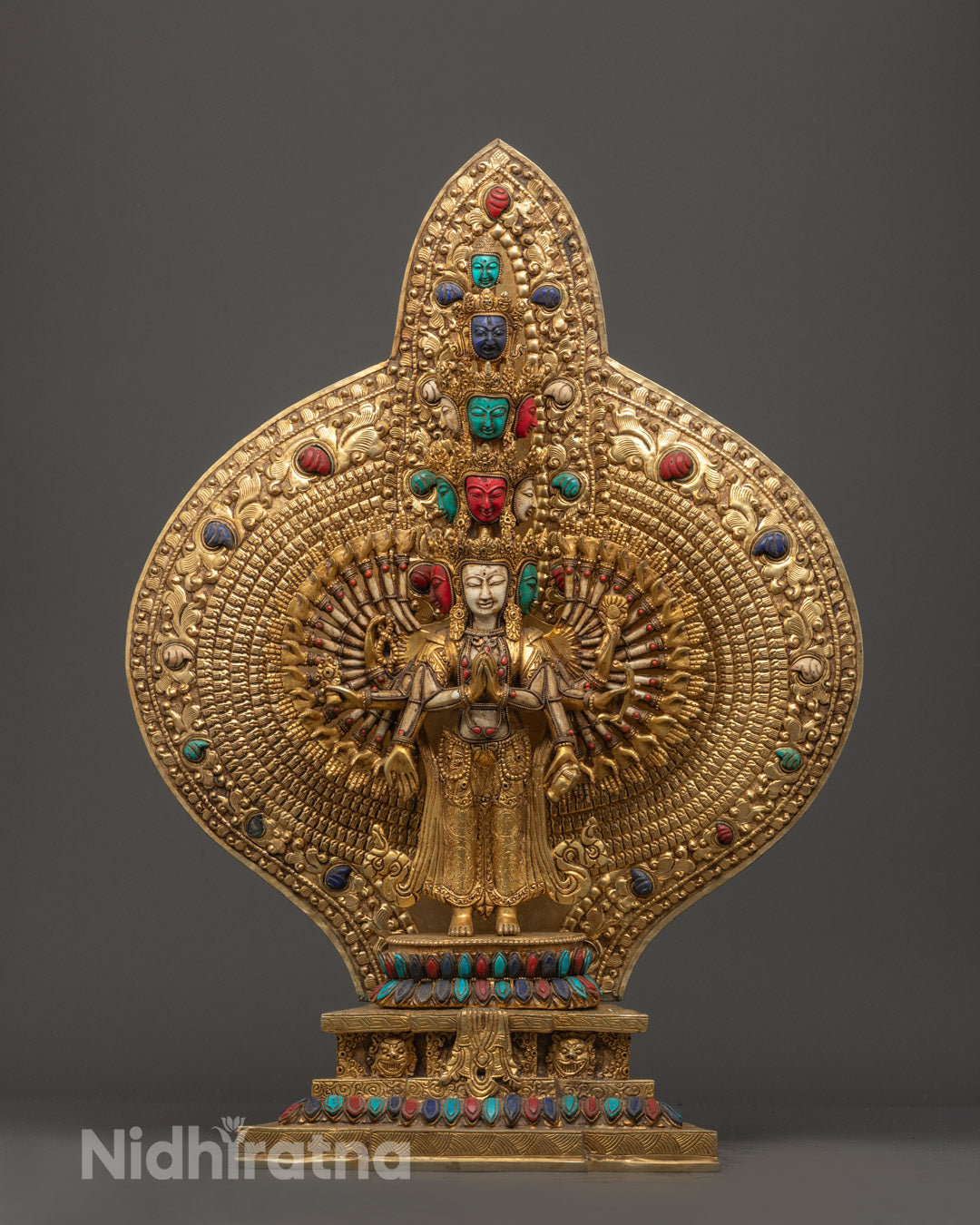 hand-carved 1000 Arm Chenrezig Statue showcasing gold fire gilded finish and semi-precious stone adornments.