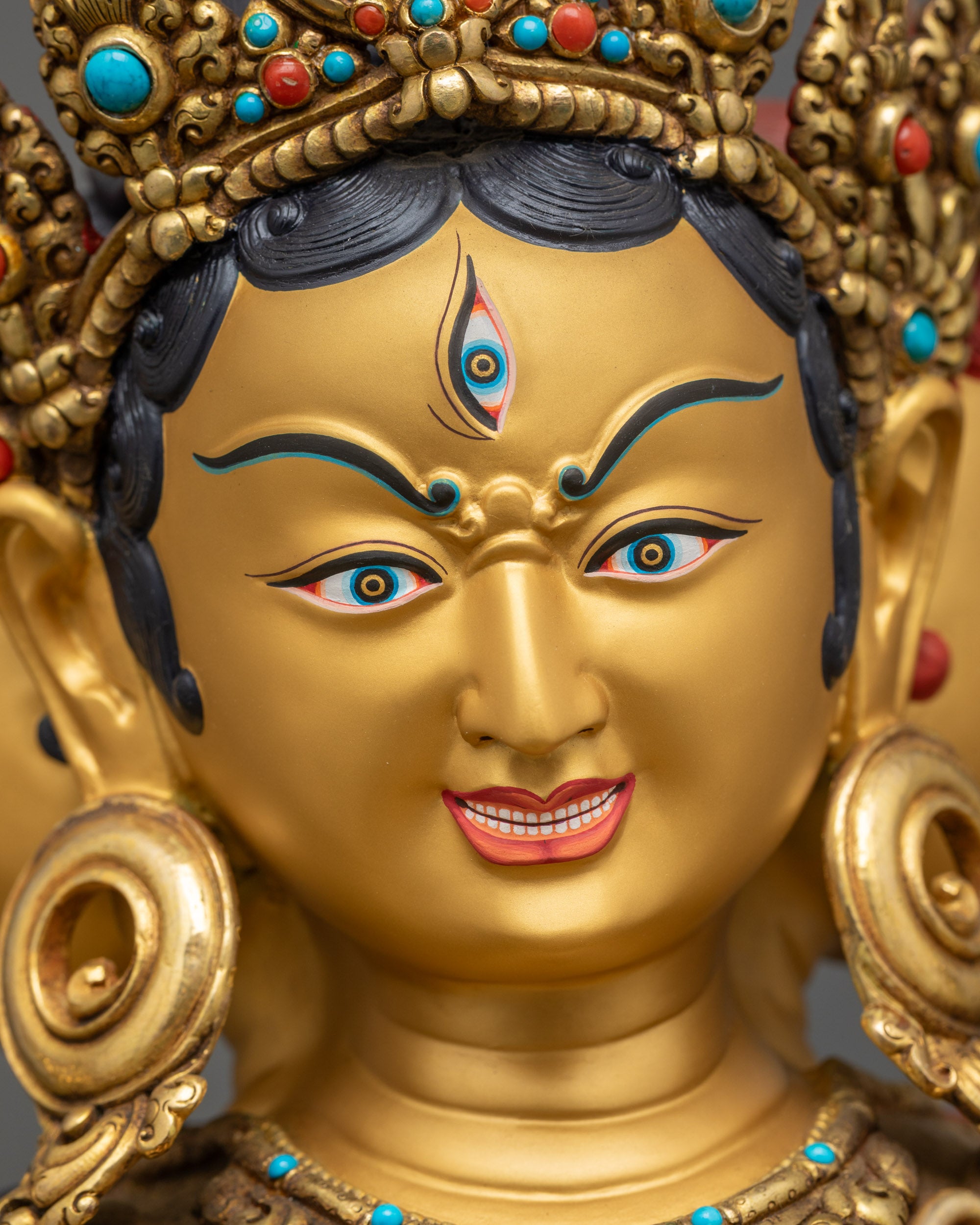 Detailed close up Namgyalma Gold-Gilded face with third eye for spiritual protection