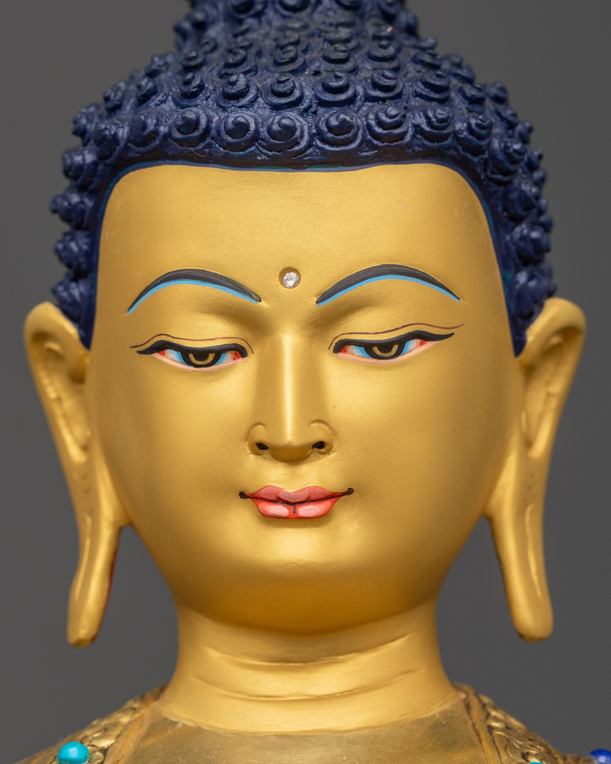 Detailed close up face Amitabha Buddha 24k gold-gilded copper peaceful expression