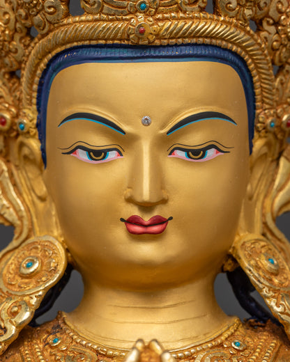 Detailed close up face Avalokiteshvara Buddha with gold-gilded features and serene expression