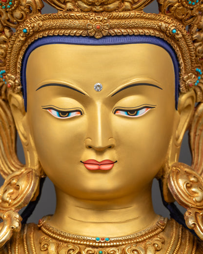 Detailed close up face Chenrezig statue serene gold-gilded Avalokiteshvara face