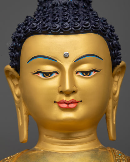 Detailed close up face Shakyamuni Buddha gold-gilded serene expression copper alloy
