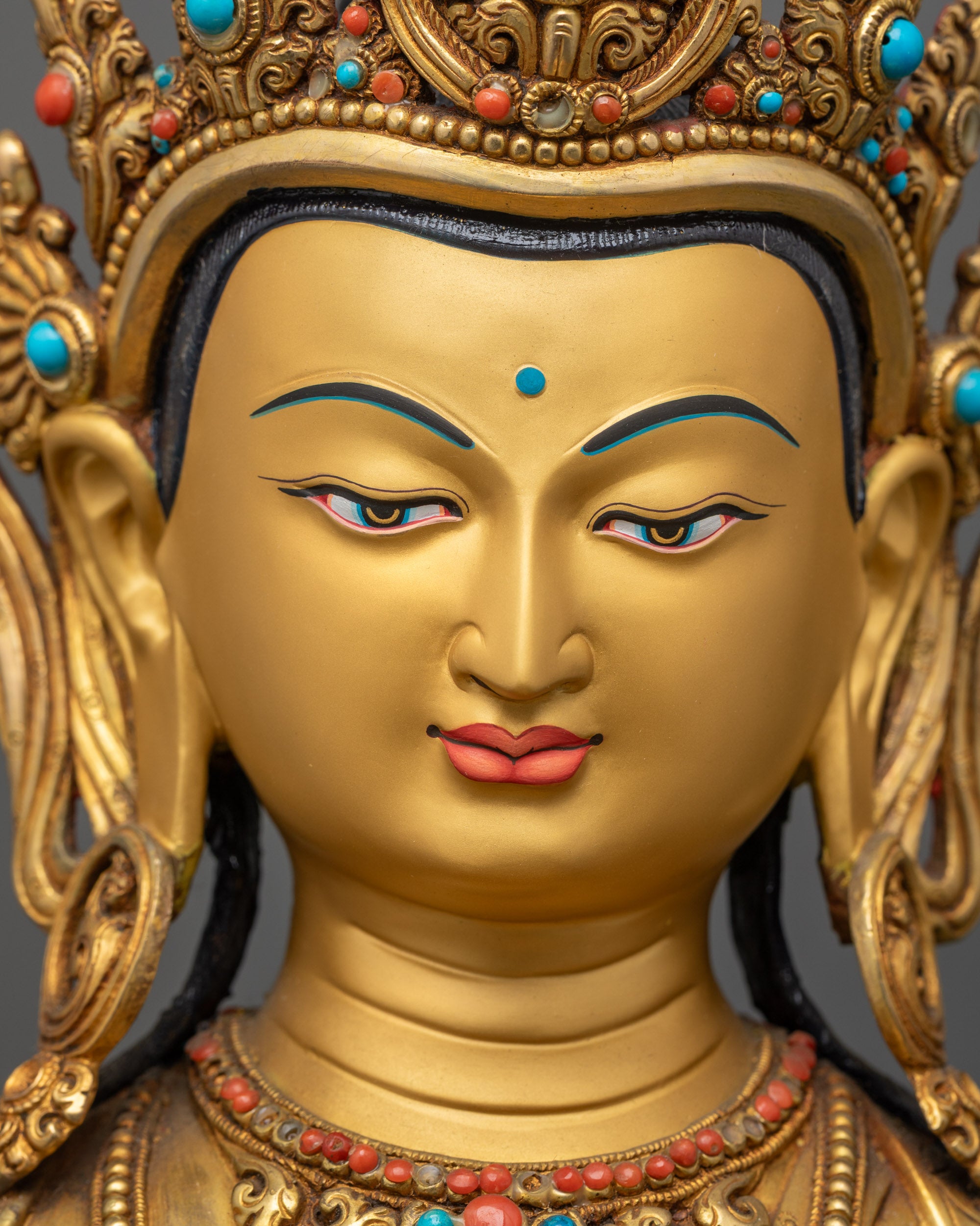 Detailed close up face Vajrasattva gold-gilded serene Buddhist deity idol craftsmanship
