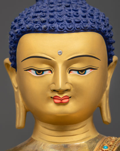 Detailed close up face of Amitabha Buddha with serene expression and semi-precious stones
