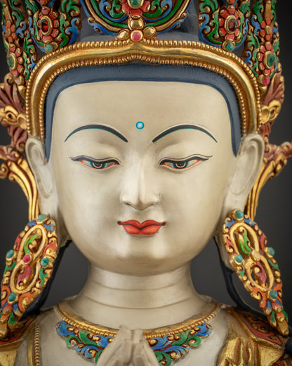Detailed close up face of Chenrezig Bodhisattva showing hand-painted crown and features