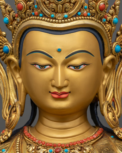 Detailed close up face of Chenrezig Buddha with calm gold-gilded expression
