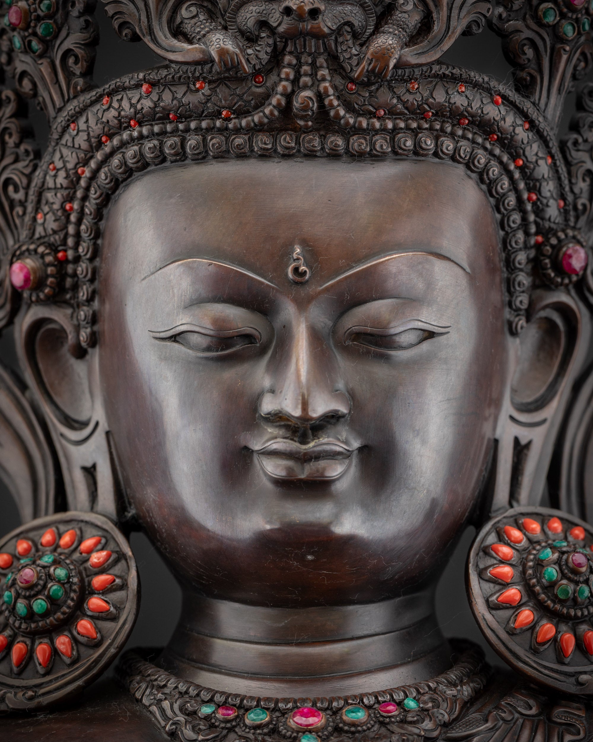 Detailed close up face of Crowned Shakyamuni Buddha, Newari handcrafted statue
