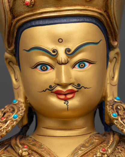 Detailed close up face of Guru Rinpoche statue showing wrathful yet calm expression
