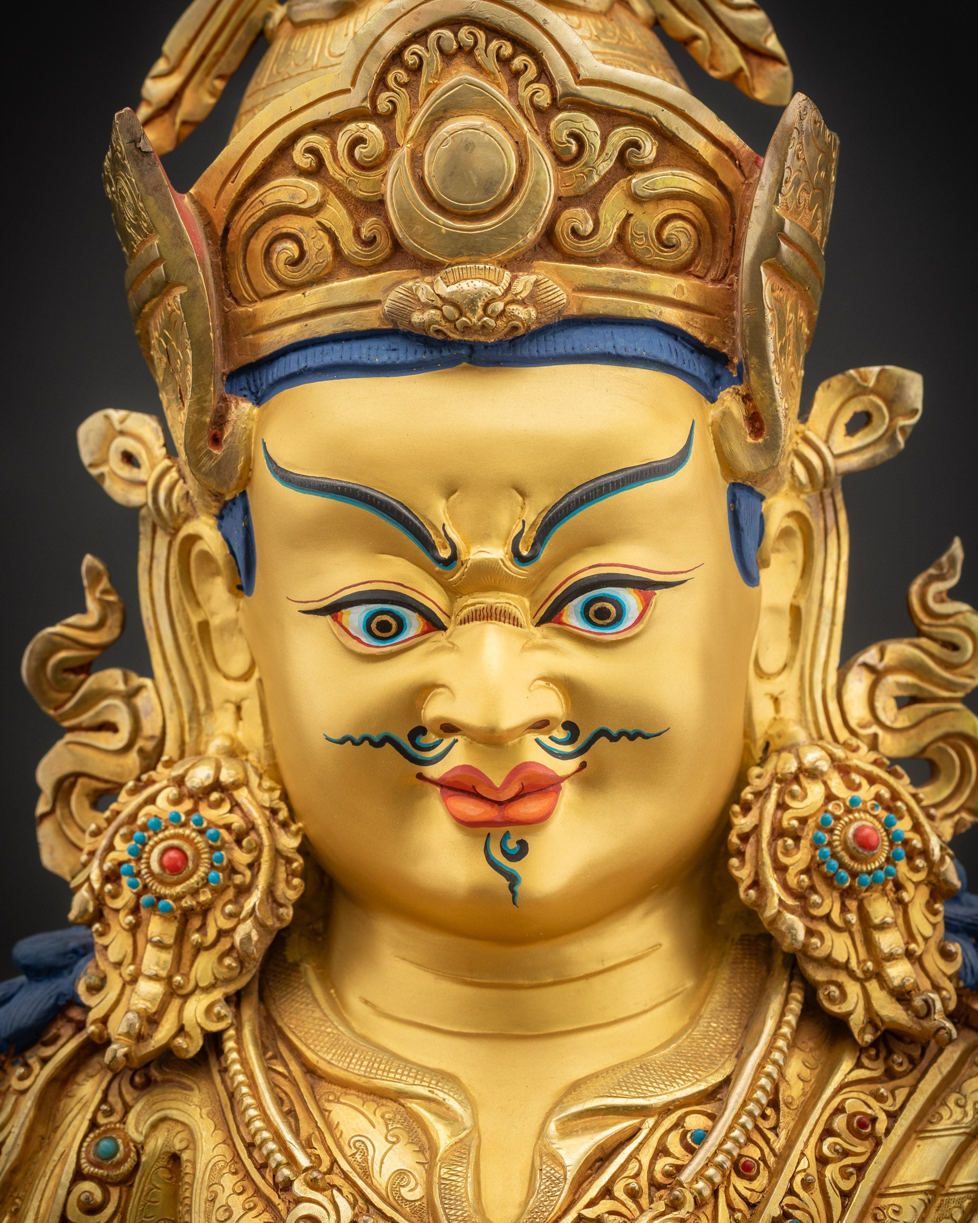 Detailed close up face of Guru Rinpoche with Semi-compassionate expression