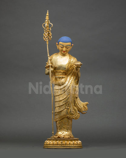 Detailed close up face of Maudgalyayana Buddha Disciple with radiant gold fire-gilding