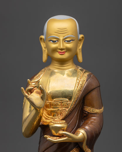 Detailed close up face of Maudgalyayana disciple with serene expression and gilding
