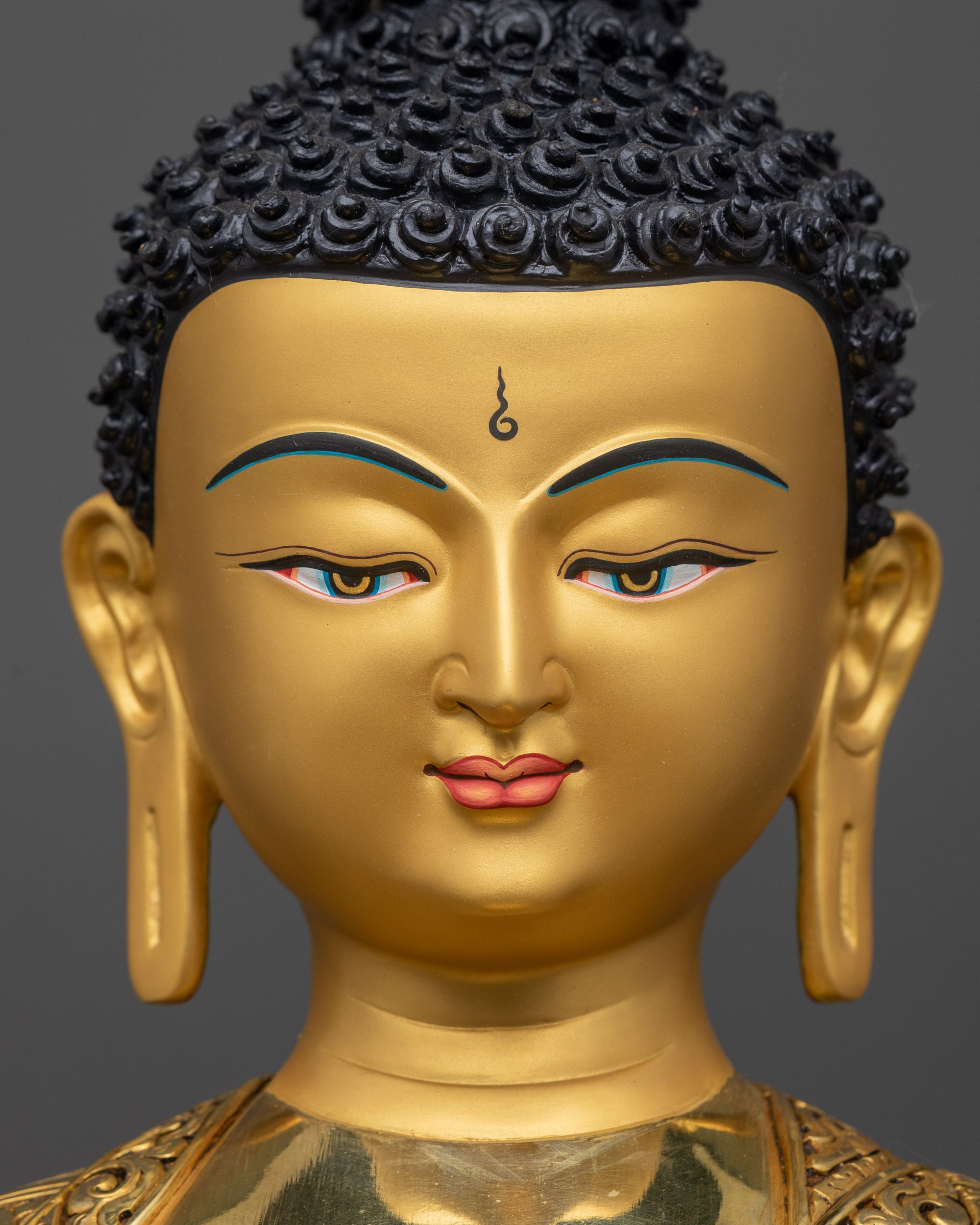 Detailed close up face of Medicine Buddha with radiant gold halo and serene expression
