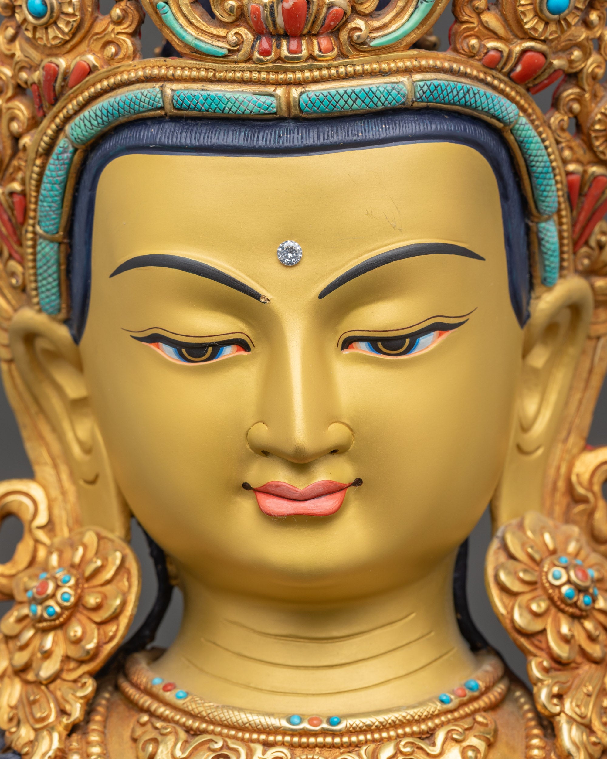 Detailed close up face of Padmapani Bodhisattva statue with five-jewelled crown