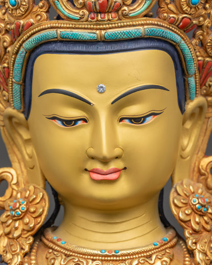 Detailed close up face of Padmapani Bodhisattva statue with five-jewelled crown