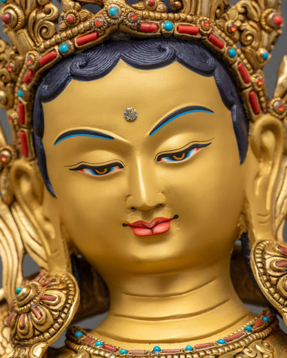 Detailed close up face of Premium Green Tara with serene expression and gold-gilded features
