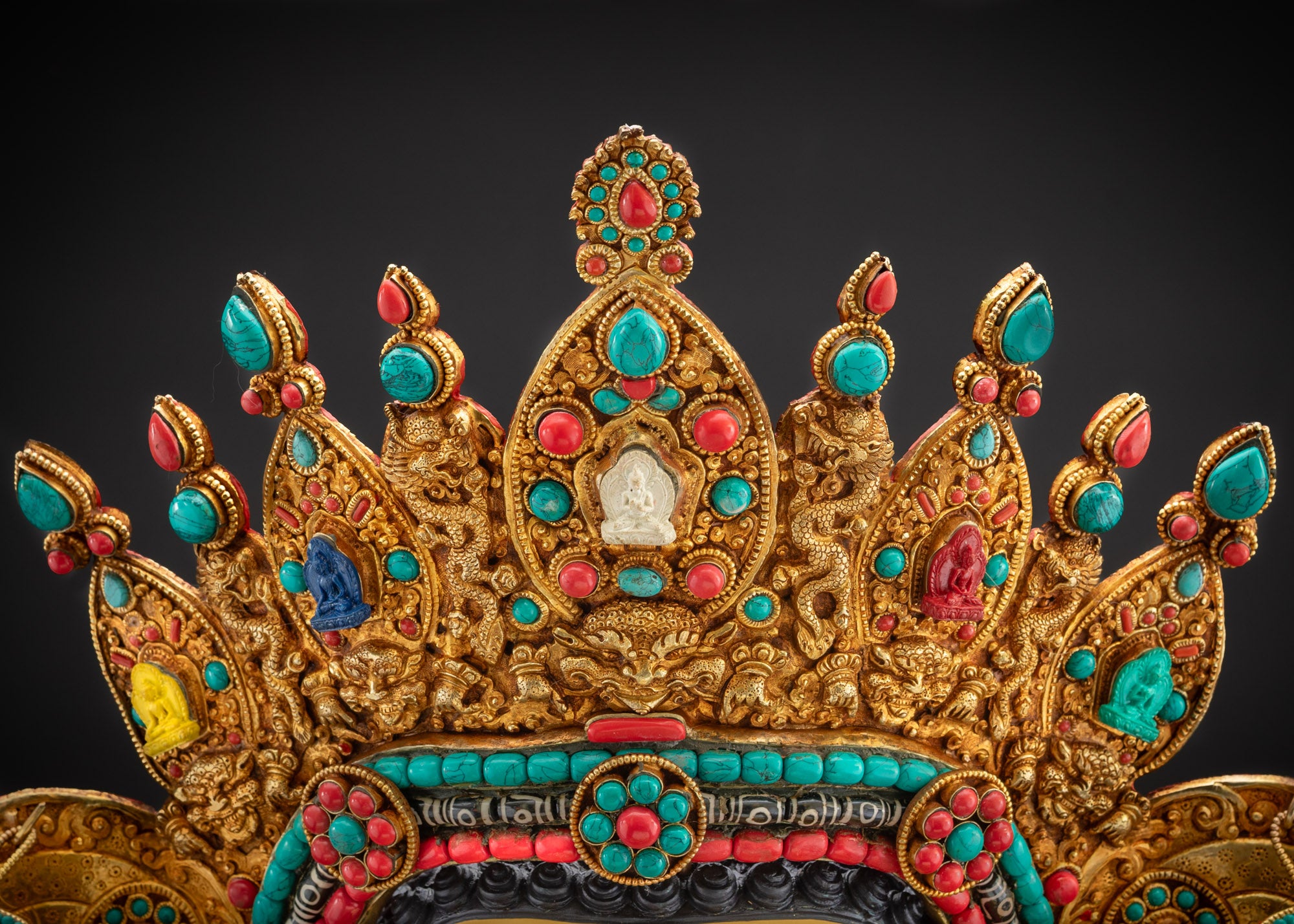 Detailed close up of Five Buddha crown symbolizing Vajrayana wisdom on Tibetan Buddha statue