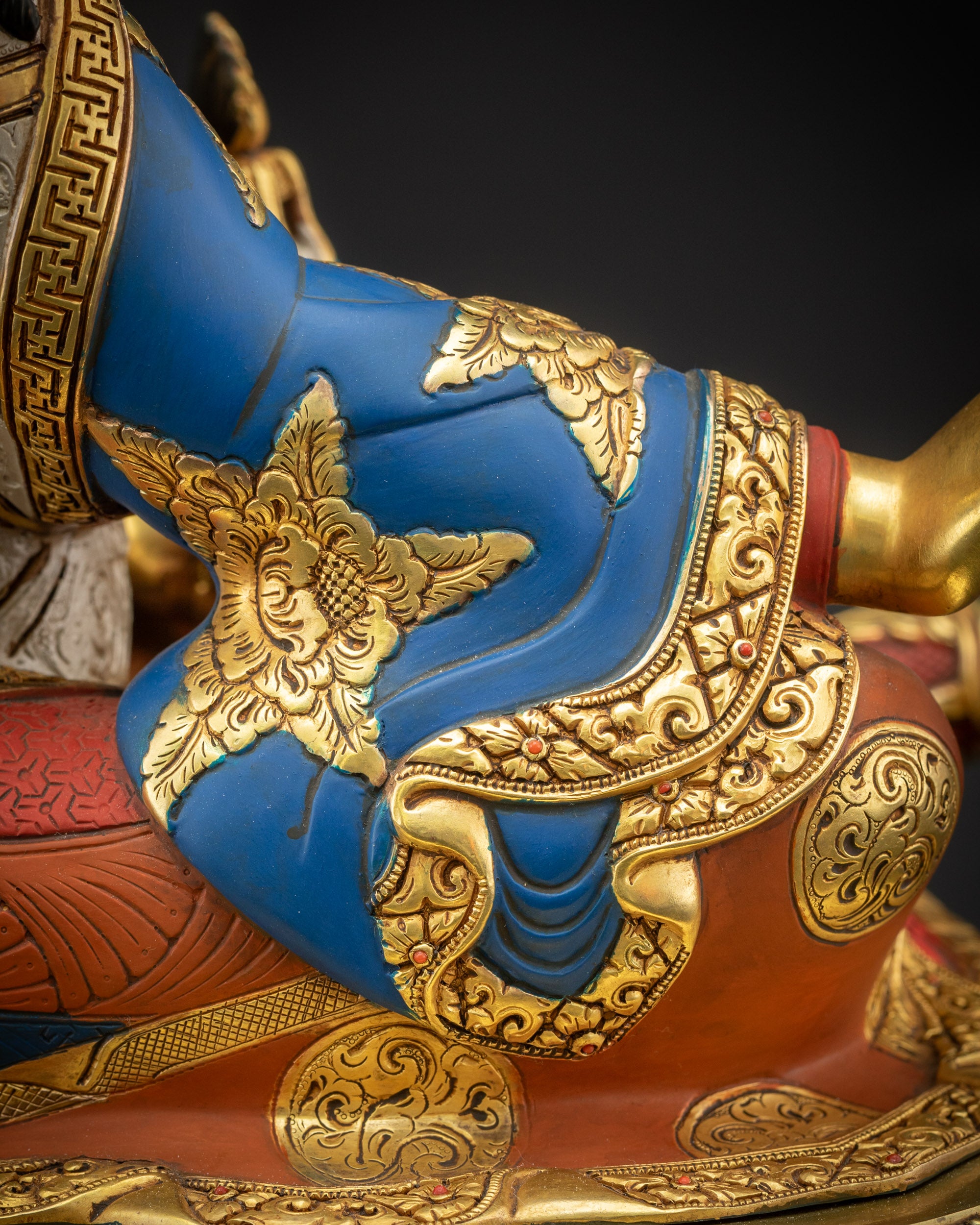 Detailed close up of Guru Padmasambhava robe with sacred motif patterns