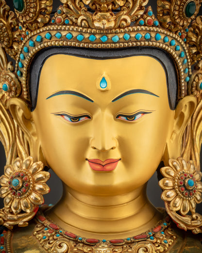 Detailed close up of face highlighting gold-gilded finish and serene facial expression
