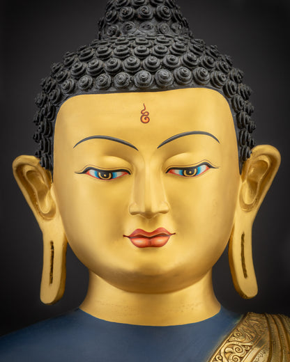 Detailed close up of face of Nepalese Healing Medicine Buddha highlighting calm serene features