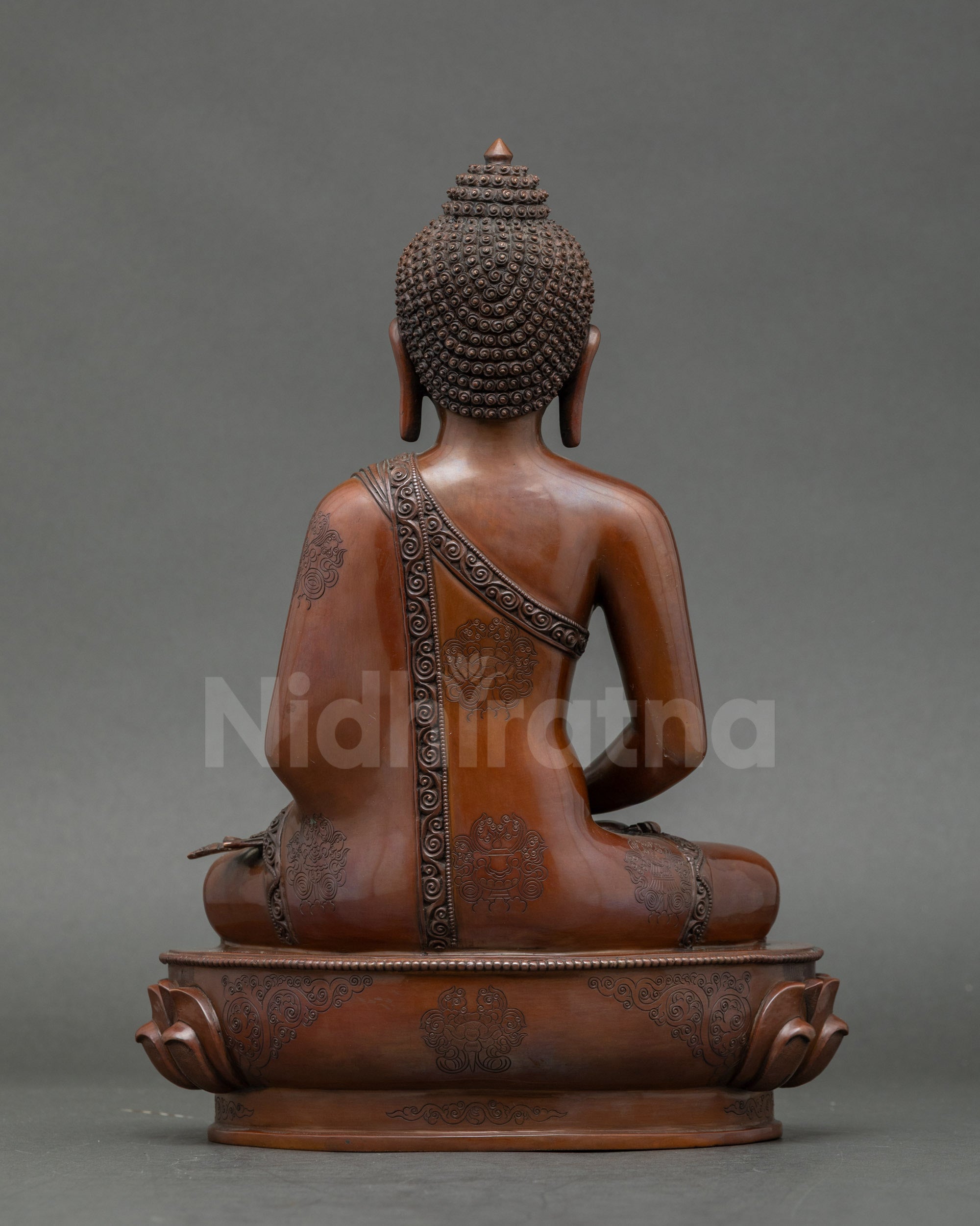 Detailed face close-up of gold-gilded Amitabha Buddha meditation idol from Nepal
