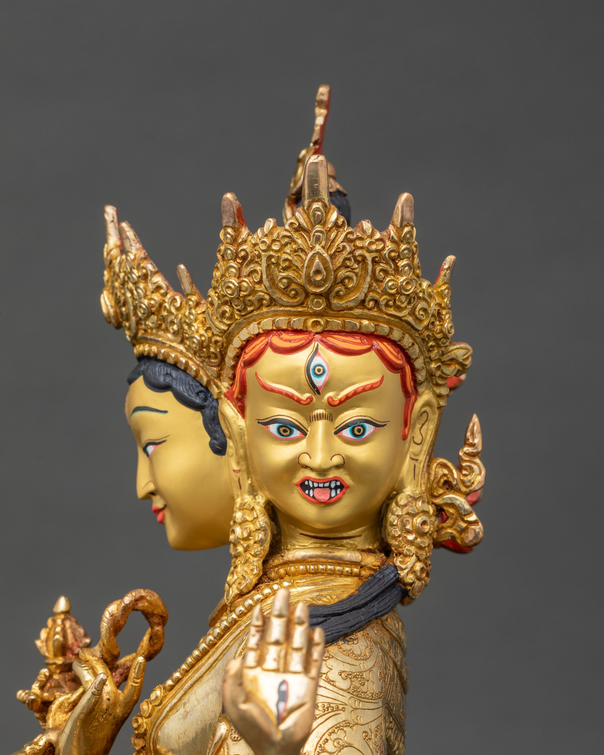 Detailed face close up of Namgyalma three faces with serene expression and crown
