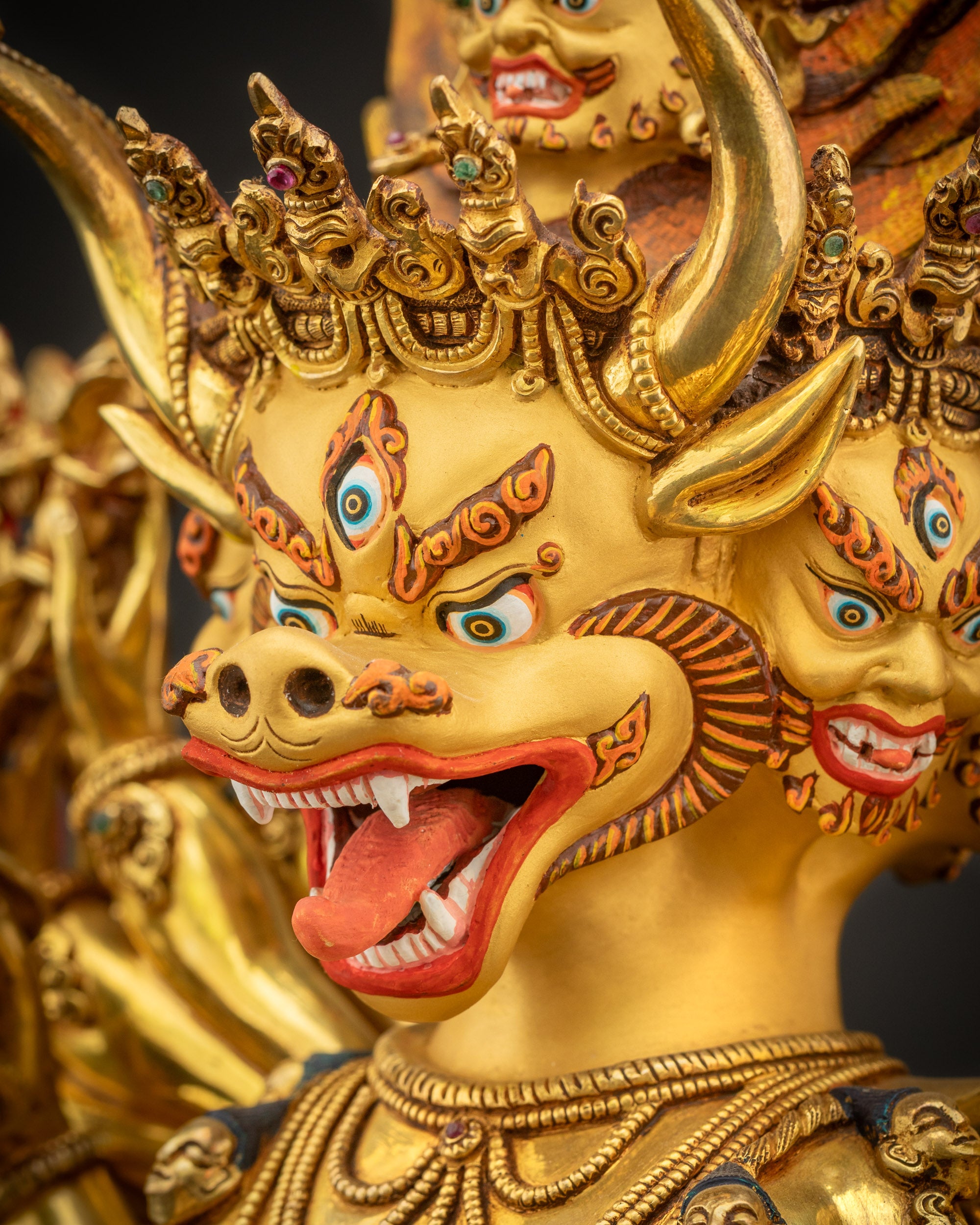 Detailed face close up of Yamantaka with wrathful buffalo head, nine faces, third eye, and skull diadem