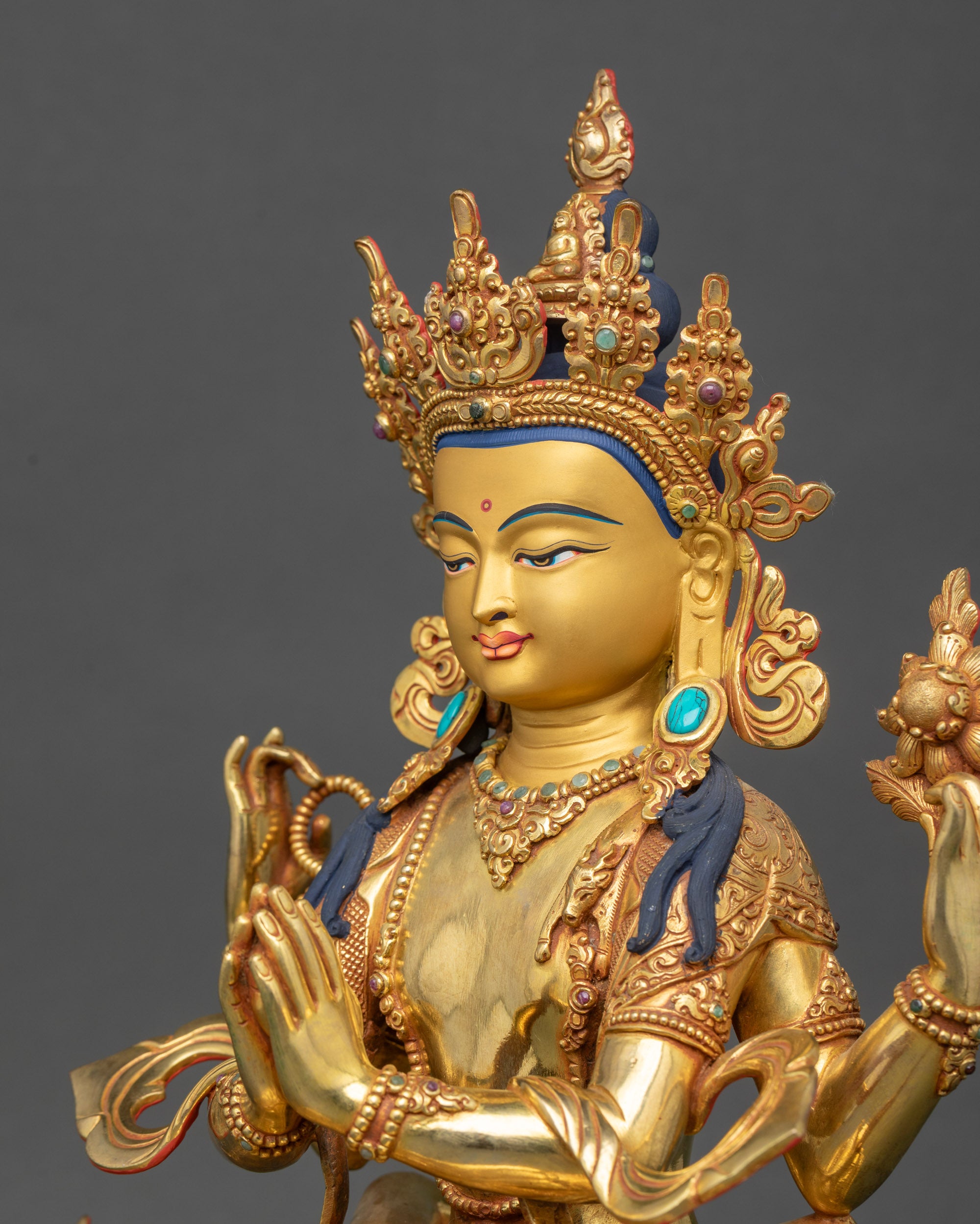 Detailed face of Chenrezig embracing consort with gold fire-gilding

