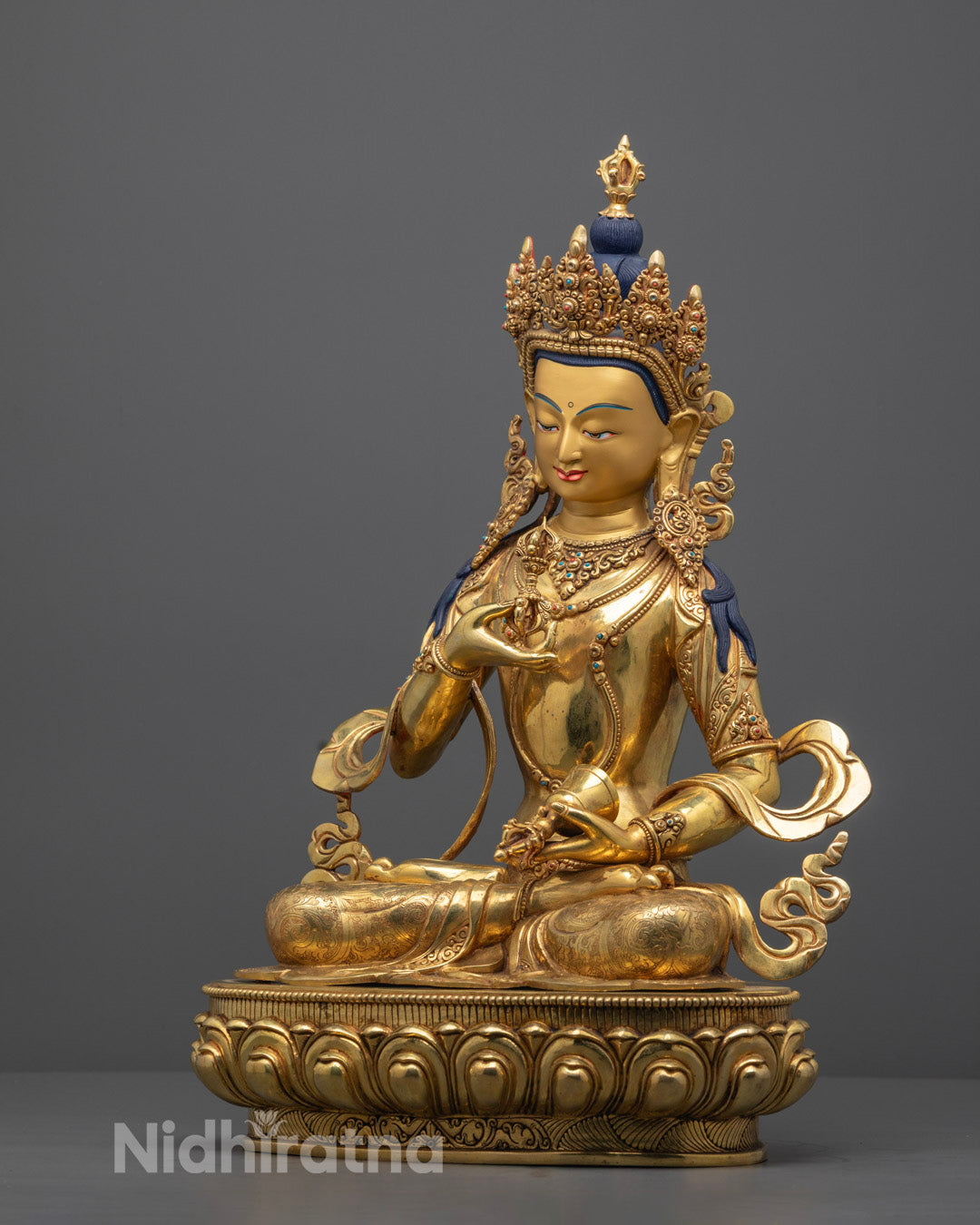 Detailed hand-carved Chenrezig statue from Nepal, with 24k fire-gilded gold finish and hollow chamber for consecration, symbolizing compassion and protection.