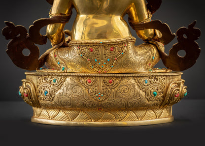 Detailed landscape back view of statue seated on lotus showing carved robe folds
