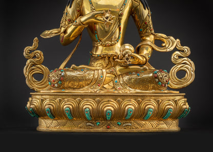 Detailed landscape front shot statue seated on lotus seat with halo and crown