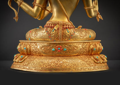 Detailed landscape shot back Maha Manjushri Statue seated on lotus base with intricate carvings
