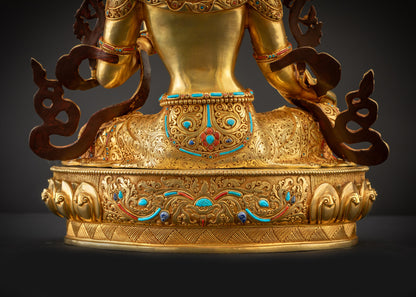 Detailed landscape shot back of Green Tara statue showing intricate robe folds
