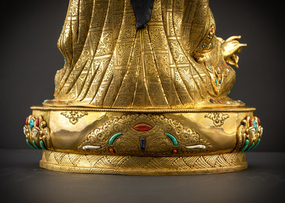 Detailed landscape shot back view of Guru seated showing engraved motifs
