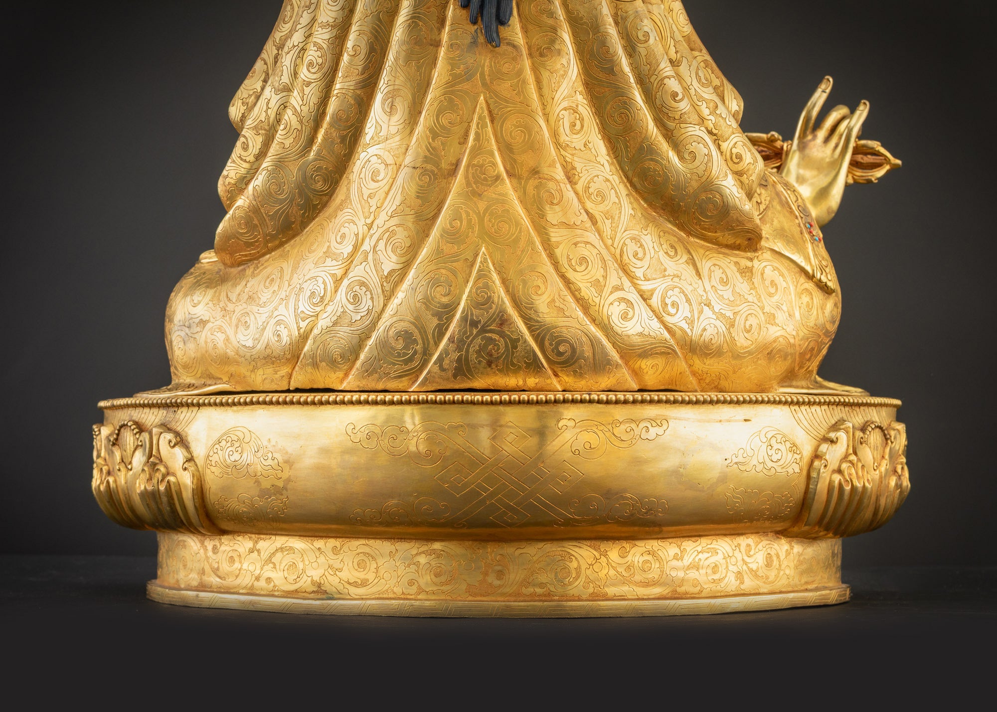 Detailed landscape shot of Guru Rinpoche seated on lotus back view
