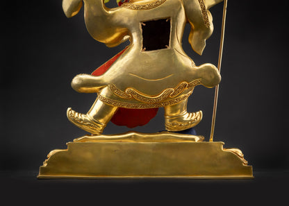 Detailed landscape shot of Nechung Chuyong Statue Standing on lotus seat back view