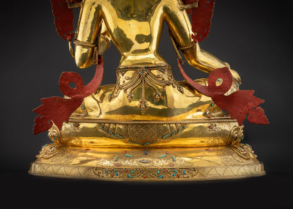Detailed landscape shot of statue seated on lotus seat back Green Tara back view meditation statue
