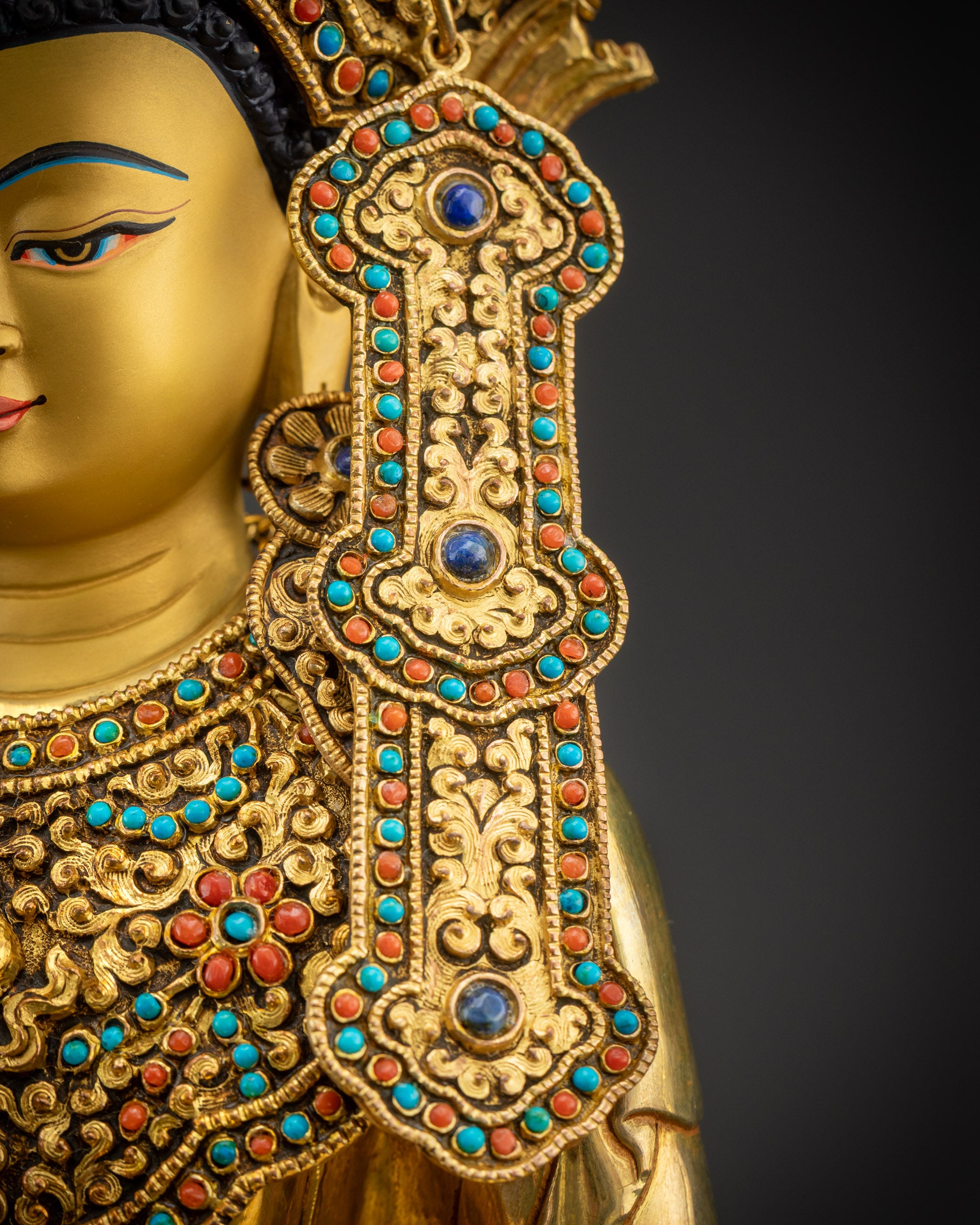 Detailed right side earrings of sacred Jowo Rinpoche Buddha statue
