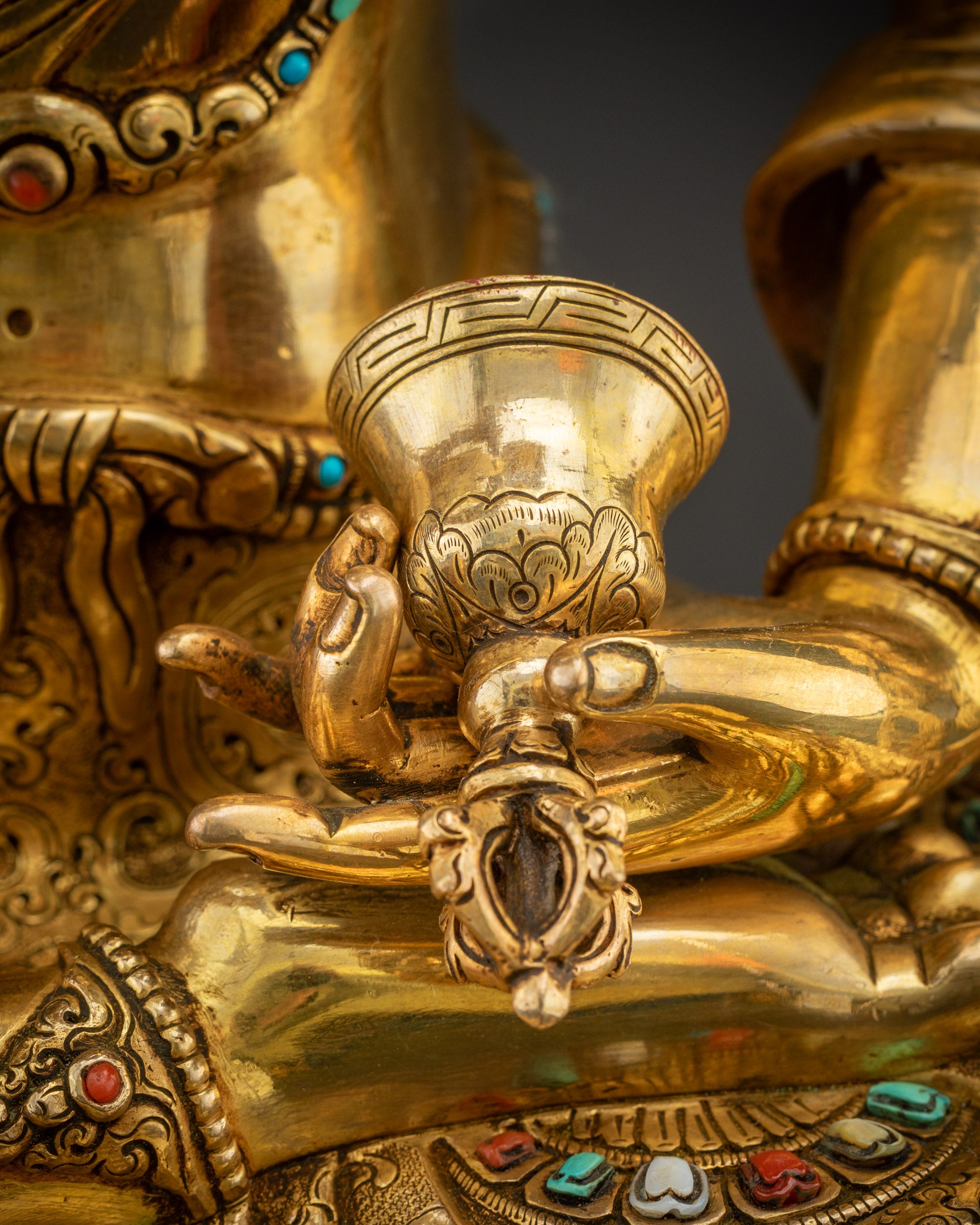 Detailed shot Dorje Sempa holding bell  with ornate jewelry details