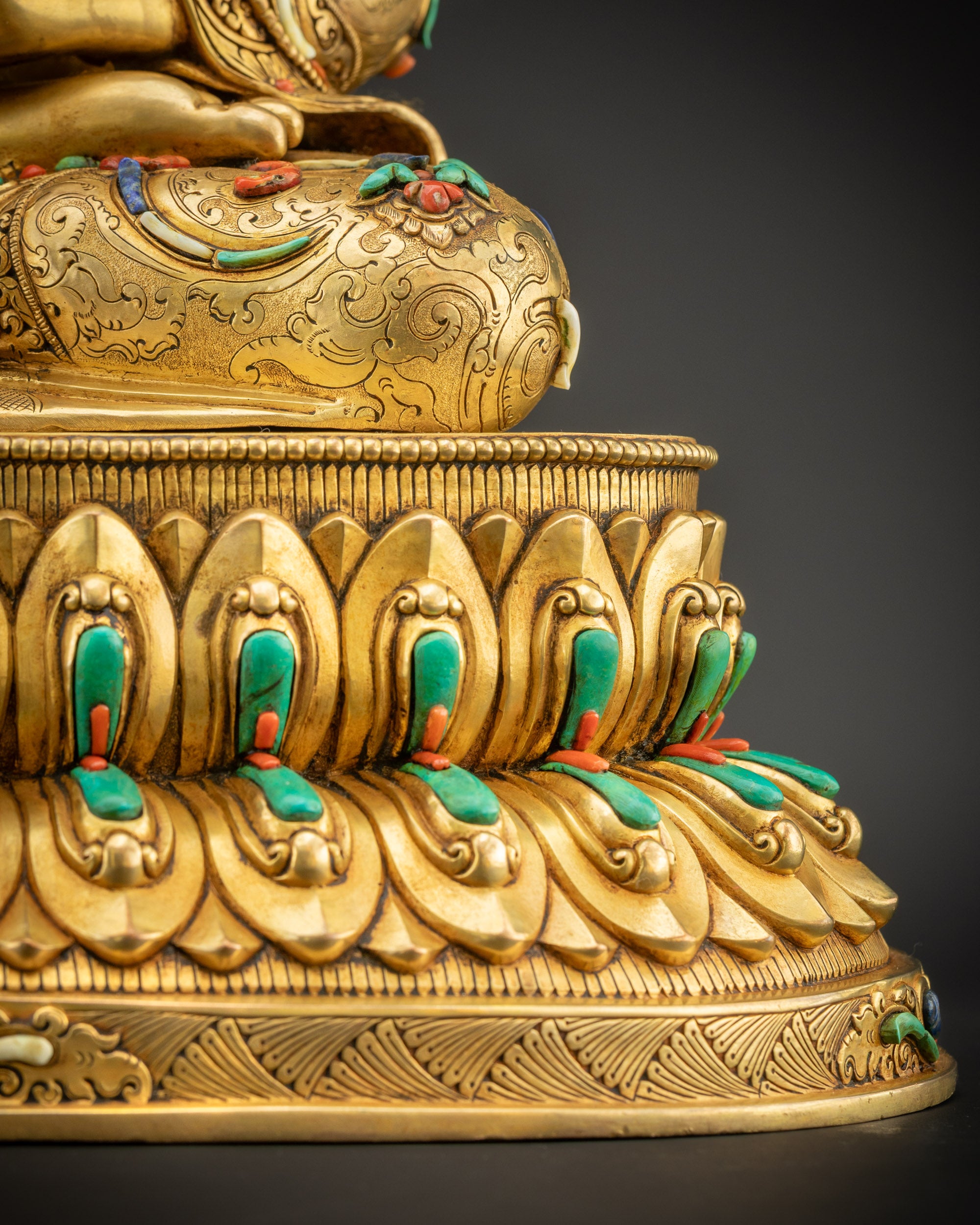 Detailed shot of Amitabha Buddha seated on double-layered lotus seat with dharma wheel
