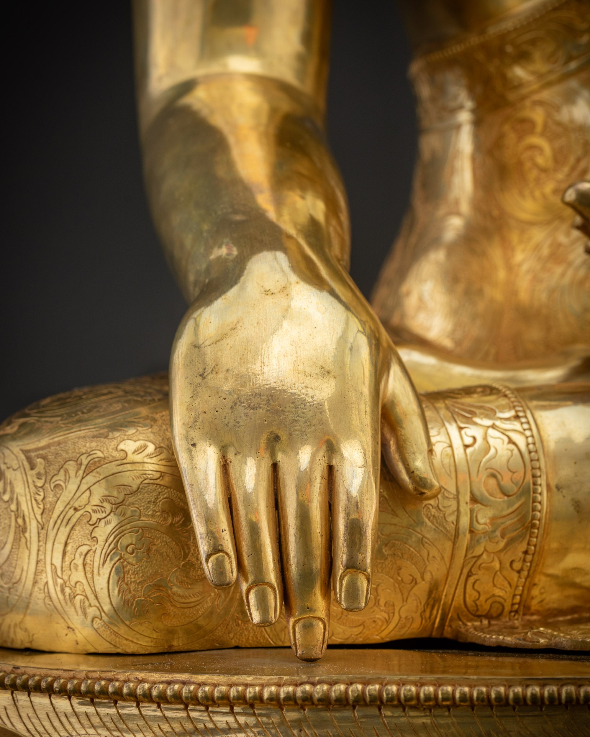 Detailed shot of Bhumisparsha mudra on Shakyamuni Gautama Buddha statue Nepal