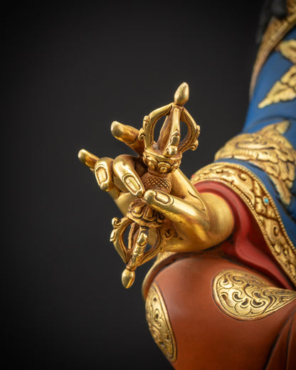 Detailed shot of Guru Rinpoche holding vajra symbol of indestructible wisdom